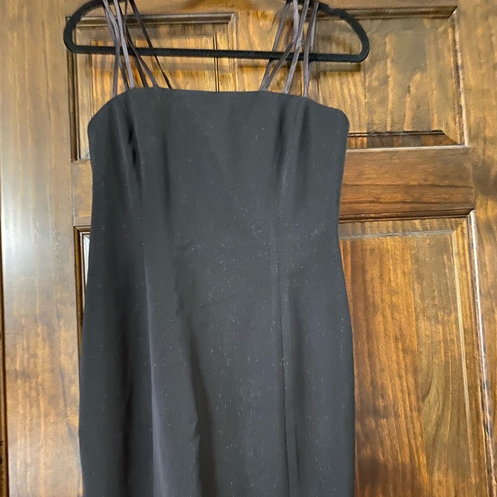 Beautiful, flattering, knee-length black dress.